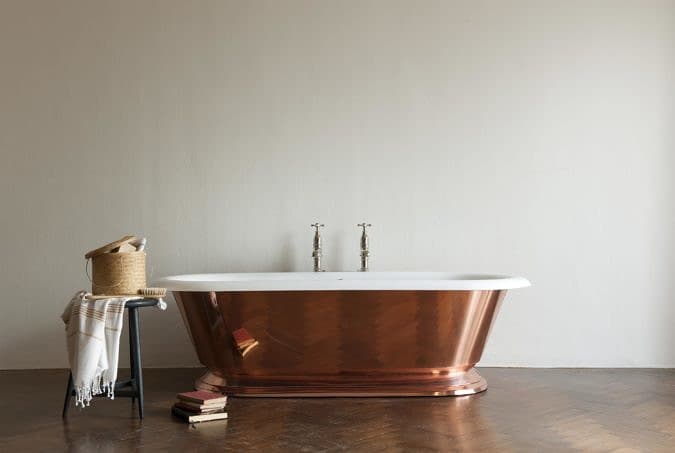 The Copper Tay cast iron skirted bath tub