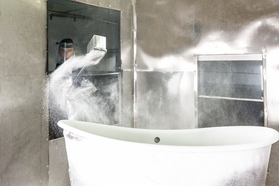 Dry Frit Enamel is sprinkled by hand over each bath, resulting in an extremely durable, undulating finish.