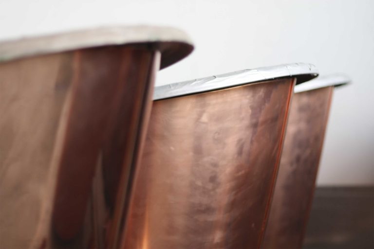 Our cast iron baths can be clad in either brass or copper, combining durability with elegance.
